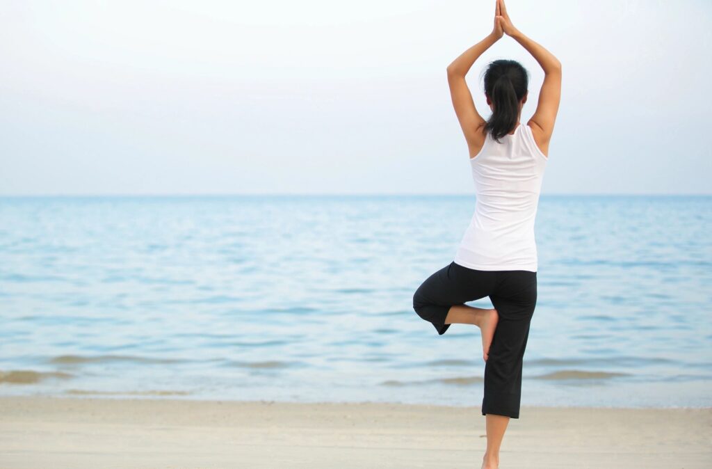 Yoga students practicing yoga in a peaceful Sri Lankan natural setting